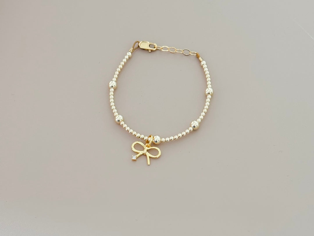 14k gold filled beaded bracelet with bow charm