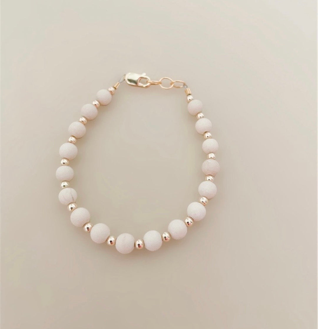 Tan &amp; gold layer bracelet