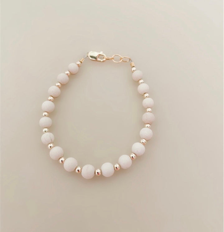 Tan &amp; gold layer bracelet